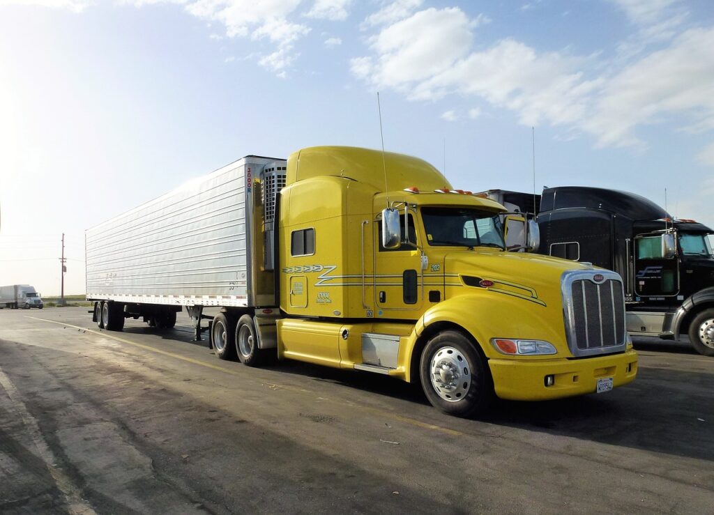 transport, automobile, truck, vehicle, trailer, yellow, car park, truck truck, truck american, truck, truck, truck, truck, truck, trailer, trailer-3210728.jpg